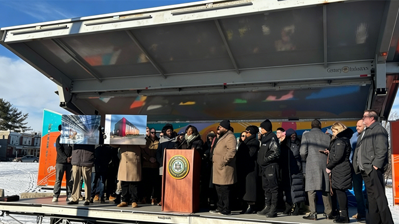 Modular affordable housing groundbreaking ceremony in winter, city officials launching prefabricated building project for community housing